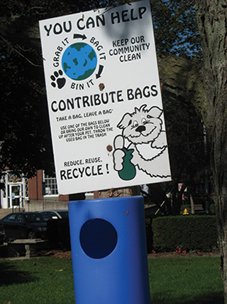 Figure 3. Picking up and properly disposing of pet waste in the garbage is one way to help keep stormwater runoff clean. 