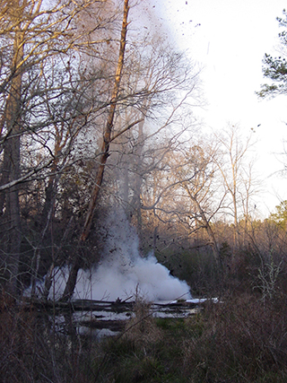 Figure 10. Use of explosives to remove a beaver dam and reduce flooding