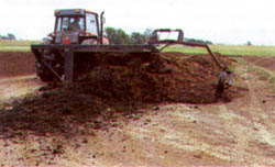 Figure 1. Turning of a composting windrow.