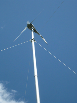 Figure 1. Small wind turbines come in many sizes from micro turbines like the 400 watt turbine above (a) to turbines as large as 50 to 100 kW like the 50 kW turbine pictured above (b). 