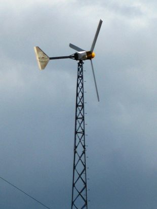 Figure 2. Two common styles of horizontal axis wind turbines are upwind (using tail to face into the wind, Figure 2a) and downwind (wind blows around tower to reach blades, Figure 2b).