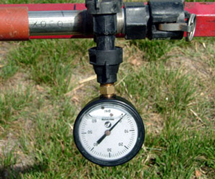 Figure 10. Gauge to check spray pressure on a wet boom. 