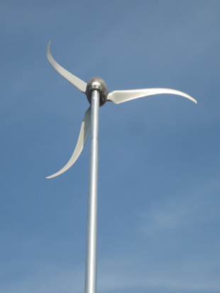 Figure 2. Two common styles of horizontal axis wind turbines are upwind (using tail to face into the wind, Figure 2a) and downwind (wind blows around tower to reach blades, Figure 2b).