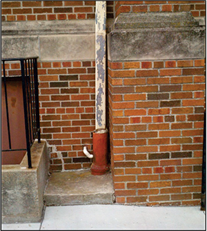 Figure 1. Downspout routed into a sanitary sewer connection – an illegal practice.